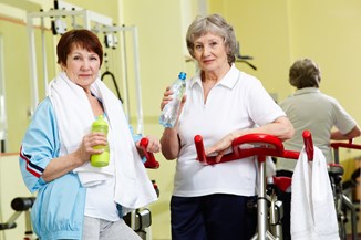 Two women in the gym on a referral scheme.
