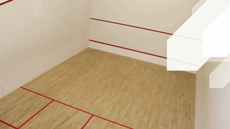 Squash Court at Broadmeadow Sports Centre, Teignmouth. Wooden floor with red marked out zones for squash to be played.